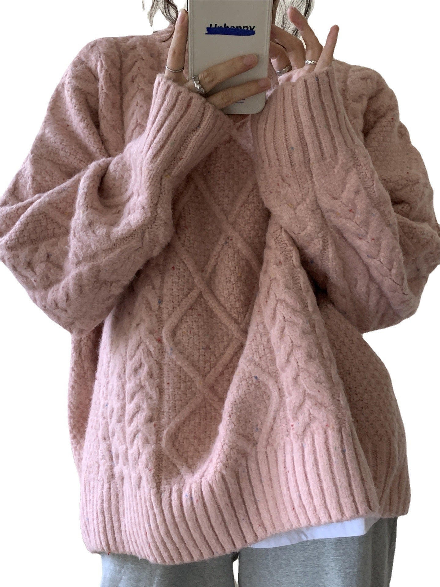 Women Wearing Loose Sweaters Outside The Street With Gentle Wind